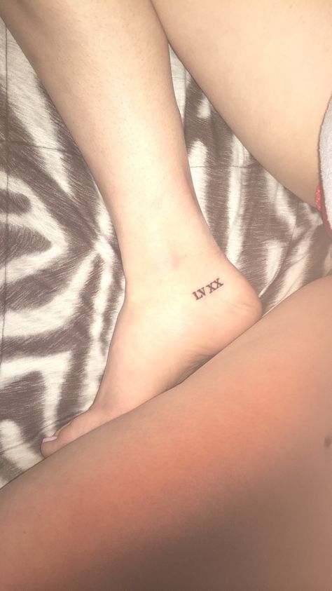 Roman Numeral Tiny tattoo Ankle Tattoo Roman Numerals, Roman Numeral Ankle Tattoos For Women, Roman Numeral Tattoo On Ankle, Roman Numeral Ankle Tattoo, Ankle Number Tattoo, Number Tattoo Ankle, Birthdate Tattoo, Roman Tattoo, Roman Numeral Tattoo