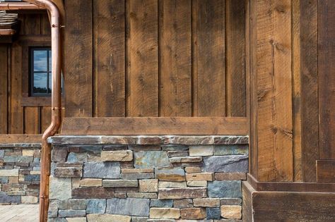 Board and batten with stone veneer (notice the finish/trim board above the stone ledge.  Copper pipe is a nice touch. Stone Veneer Wall, Exterior House Siding, Wood Siding Exterior, Rustic Exterior, Cabin Exterior, Shutters Exterior, Exterior Remodel, House Siding, Exterior Cladding