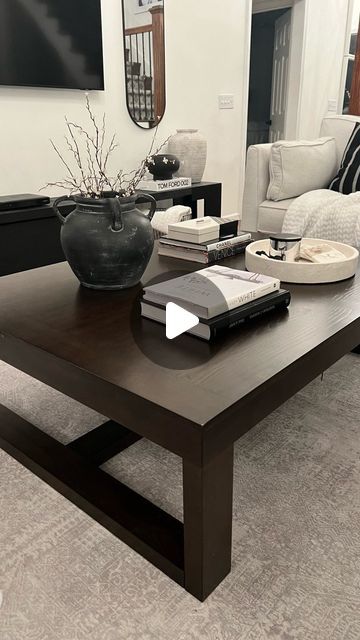 Gilla Leigh Home Designs on Instagram: "I’m obsessed with my new modern XL coffee table I found today. My hubby was going to buy me jewelry for our anniversary, but I decided on this piece instead :)   I absolutely love the size of this beautiful modern lines of this coffee table and obsessed with the dark rich brown undertones. I know light wood is all the trend, but this girl loves the rich dark tones in her home.  This XL coffee table is 42in wide by 56 in long. I love large coffee tables , they are so fun to style and design.  I found it at NFM and I linked it in my LTK a link in bio . Where you can order it directly from Ashley furniture. It comes in grey, light brown, or dark brown like mine .  I love the warm neutral contrast of the rich brown tones with all of my black and white de Dark Brown And White Living Room, Dark Brown Coffee Table, Dark Brown Table, Dark Wood Coffee Table, Black Glass Coffee Table, Large Square Coffee Table, Brown Sofa Living Room, Beige Couch, Brown Coffee Table