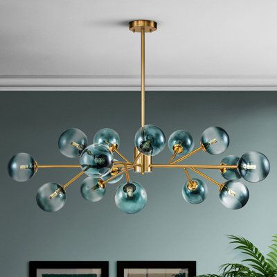 With a branching arm design, the 15-light Sputnik stairs linear chandelier is sure to make a bold statement in a living area in which you can hang it as an abstract work of art. This chandelier creates dispersed light with 15 glass globes in a different direction that greatly broadens your illumination area. This unique chandelier complements a range of interior spaces in a contemporary style. This mobile chandelier makes for an ideal addition to your stairs, living room, dining room, bedroom, a Glass Globe Chandelier, Mobile Chandelier, Lighted Branches, Unique Chandeliers, Bubble Chandelier, Inspire Me Home Decor, Globe Chandelier, Sputnik Chandelier, Gold Chandelier