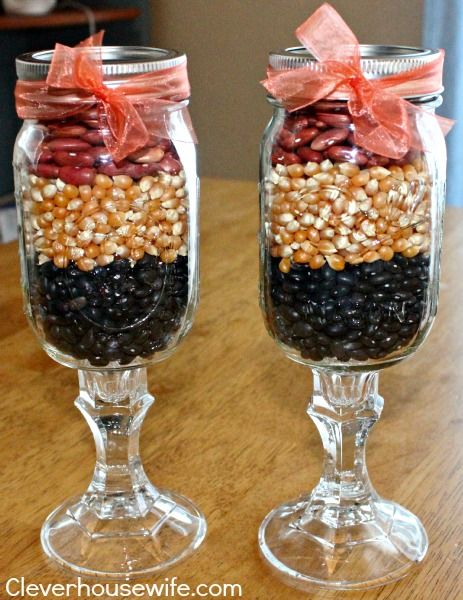 Mason Jar Wine Glasses used for Fall Decor with Dry Beans and Corn Kernels Fall Mason Jar With Fairy Lights, Candy Corn Mason Jar, Clear Glass Pumpkin Jar Decor, Glass Pumpkin Jar, Candy Corn Apothecary Jars, Jar Fillers, Fall Harvest Party, Fall Candy, Decorated Bottle