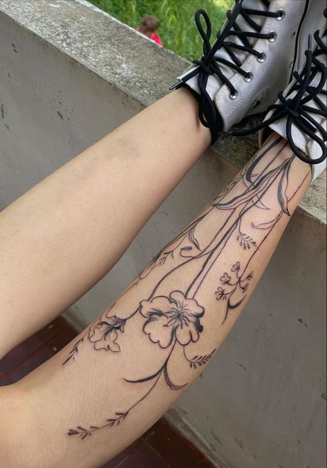 Cool Shin Tattoos, Ankle Flower Tattoo Wrap Around, Floral Shin Tattoo, Flower Shin Tattoo, Aesthetic Leg Tattoos, Wildflower Leg Tattoo, Couple Tattoo Simple, Wrap Around Leg Tattoo Women, Women Spine Tattoo