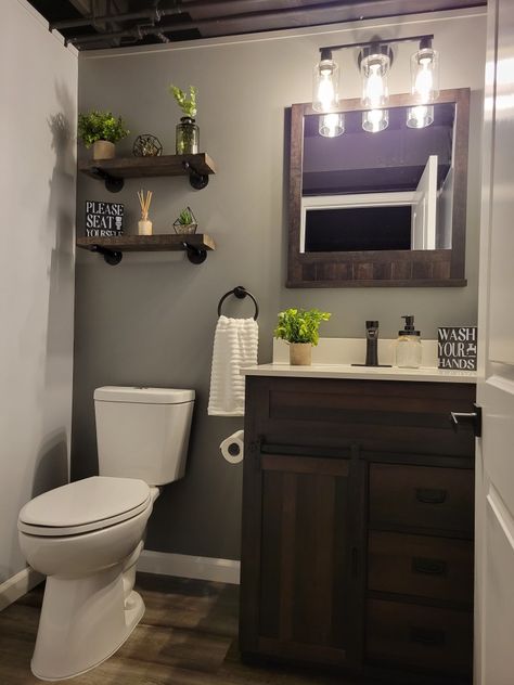 Rustic/ farmhouse/ industrial floating shelves/ Amazon decor Dark Farmhouse Bathroom Ideas, Small Bathroom Dark Vanity, Espresso Bathroom Cabinets Decor, Grey White Brown Bathroom, Brown Farmhouse Bathroom, Bathroom Decor Dark Brown Cabinets, Small Bathroom Ideas With Black Vanity, Brown Cabinet Bathroom Decor, Brown Restroom Decor Ideas