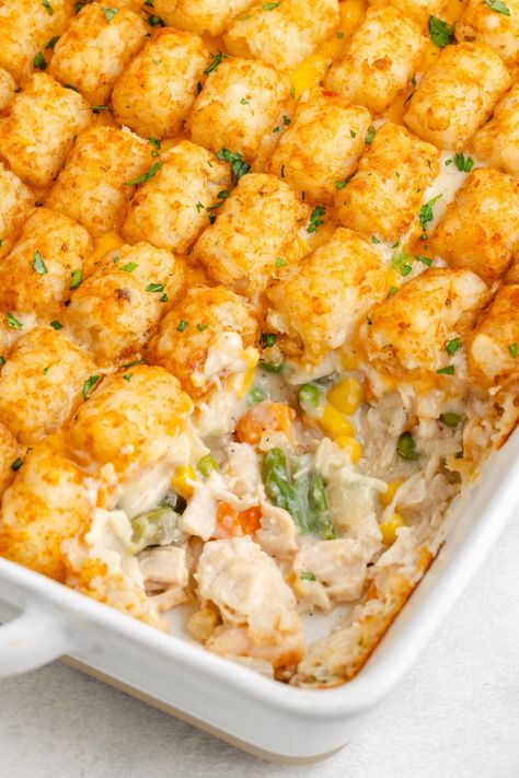 If you're searching for a hearty dish that’s perfect for feeding the whole family, look no further than this Tater Tot Chicken Pot Pie. Chicken Casserole Tater Tots, Pot Pie Tater Tot Casserole, Chicken Potato Freezer Meal, Chicken Pot Pie With Tater Tots, Tater Tot Casserole Recipes Chicken, Tater Tot Pot Pie, Recipes With Stuffing In It, Chicken Pot Pie Tater Tot Casserole, Tator Tot Chicken Casserole Recipe