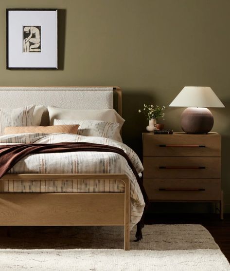 Bed with light-washed oak frames a floating, sling-style headboard of cream-colored boucle. Oak Bed Frame, Oak Beds, Storage Cabinet Shelves, Adjustable Mattress, Iron Hardware, Sideboard Console Table, Tan Top, Dining Table With Bench, Primary Bedroom