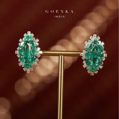 GOENKA INDIA on Instagram: "These oval-shaped earrings are made up of a mesmerizingly bright emerald and are further bordered by the sparkle of scintillating diamonds. They are suffused with an ageless charm and fantastical beauty. Connect with us on a video call & get in touch with our jewellery consultants, to experience Goenka India, just like you would do in person. To confirm your appointment with us, contact us on: +91 98926 21886 . . . #timeless #grace #beauty #signature #love #poetry Goenka Jewellery, Earrings 2024, Emerald Green Jewelry, Ear Tops, Blink Blink, Emerald Diamond Earrings, Diamond Earrings Design, Grace Beauty, Love Poetry