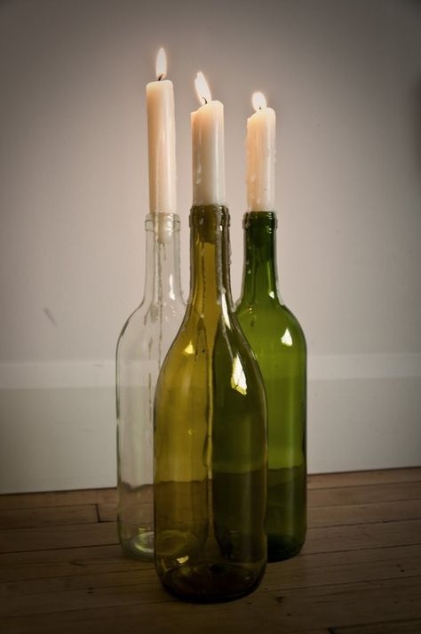 Again: You have wine. You have candles. Voilá, you have art. | 22 DIY Ways To Reuse Empty Booze Bottles Glass Bottle Candle Holder Diy, Candlestick Wine Bottle, Wine Bottle With Candle, Wine Candle Holders, Wine Bottle Candle Holders Diy, Bottle Candles Diy, Diy Wine Bottle Decor, Wine Bottle Candle Holders, Glass Bottle Candle Holder