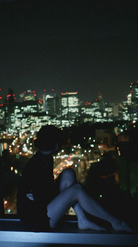 Person Sitting On Edge Of Building, Top Of A Building Looking Down, Sitting On The Edge Of A Building, Sitting On Roof Aesthetic, Sitting On Top Of Building, Overlooking City At Night, Rooftop Aesthetic Night, Women Lying Down Pose, Standing On Rooftop