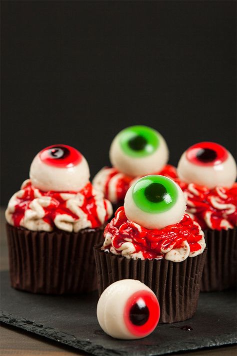 45 mins. · Makes 30 pcs. · These Spooky Delights are light and flavorful, and filled with a sweet, creamy frosting. It’s made even creepier when topped with a chewy gummy eyeball for the perfect spooky treat! Learn how to make these cupcakes with this recipe. #Recipes #Food #Crave #Tasty #Yummy #Delicious #FoodTrip #FoodLover #Recipes.net #foodporn #Cook #Cooking #Foodie #foodblog #homemade #HalloweenRecipe #HalloweenDessert #Cupcake #Chocolate Eyeball Cupcakes, Halloween Food Cupcakes, Creamy Frosting, Cupcake Chocolate, Tasty Dessert, Spooky Treats, Cupcakes Recipe, Halloween Desserts, Halloween Cupcakes