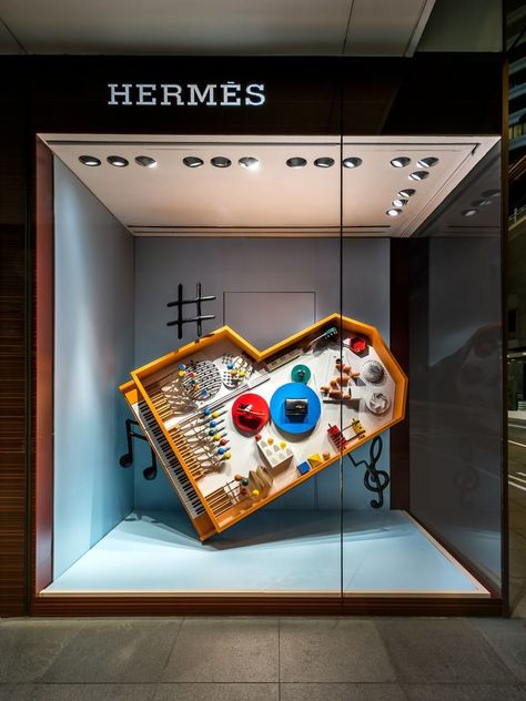 Piano at a Hermes Window Display Hermes Window, Illuminated Signage, Window Display Retail, Visual Merchandising Displays, Window Display Design, 광고 디자인, Shop Sign Design, Retail Windows, Shop Window Design