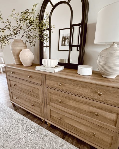 Before moving this dresser into our entryway hallway, I styled it in the front foyer. I loved the simplicity and serenity of the Neutral tones and natural textures create a calming entryway that invites warmth and peace from the moment you step inside. 🌟The first two pictures are what I styled before I decided to switch up the living room. The last three are what I ended up doing. 🤔What are your thoughts? Do you like the final result? Which one is your favorite? #HomeDecorInspo #Neutral... Buffet Table Living Room Decor, Warm Transitional Entryway, Dresser In Entryway Ideas, Clean Lines Living Room, Entryway In Living Room, Dresser In Entryway, Styled Dresser, Home Entryway Ideas, Mcgee Style