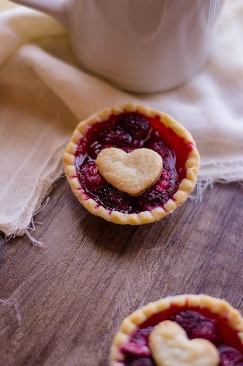 These adorable little Easy Raspberry Tarts are mouthwatering, and you won't believe how simple they are to make! All you need are a few simple items from your grocery store. #fruittart #raspberrytart #easydesserts Raspberry Tart Recipe, Easy Tart Recipes, Mini Fruit Tarts, She Cooks, Fruit Tart Recipe, Raspberry Tart, Tarts Recipe, Tart Filling, Raspberry Pie