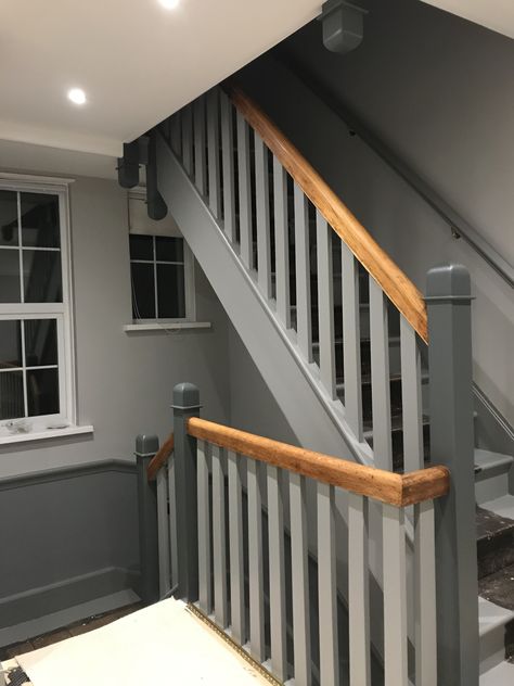 Stairs and landing in Farrow and Ball, Plummet and Pavilion Grey. Painted Hall Stairs And Landing, Grey Landing Ideas, Grey Bannister Ideas, Staircase Ideas Grey, Grey Stair Banister Ideas, Grey Banister Staircases, Hallway Coloured Woodwork, Grey And Wood Stairs, Grey Staircase Ideas