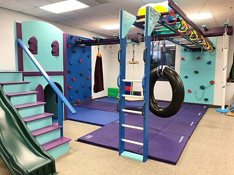 Sensory Gym – Handprints & Footsteps Pediactric Therapy Playroom Gym Ideas, Home Gymnastics Room For Kids, Basement Kids Gym, Home Sensory Gym, Sensory Gym At Home, Indoor Trampoline Playroom, Basement Jungle Gym For Kids, Garage Kids Playroom, Indoor Sensory Gym