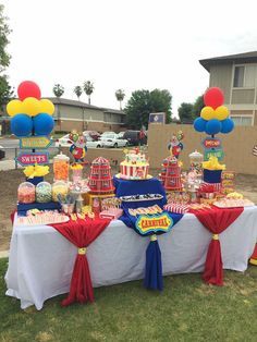 Carnival Theme Appetizers, Carnival Theme Candy Table, Carnival Birthday Party Set Up, Carnival Themed Table Decor, Carnival Candy Table Ideas, Carnival Candy Bar, 3rd Carnival Birthday Party, Carnival Theme Party Table Set Up, Fence Party Decorations