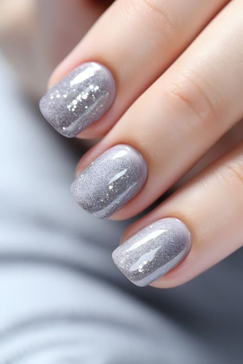 ashen gray nails, glittery nail ideas, nail design inspiration, nail art, nail trends, holiday beauty, festive nails, stylish manicure, winter season, chic nails, nail inspo, trendy designs, shimmering nails, unique nail looks, glam nails, gray polish, sparkling mani, beautiful nail art, subtle elegance, nail creativity, seasonal beauty, timeless nails, festive sparkle, nail perfection, understated glam Glittery Nail Ideas, Timeless Nails, Shimmering Nails, Nail Inspo Trendy, Nails Gray, Glittery Nail, Nails Festive, Festive Nails, Gray Polish