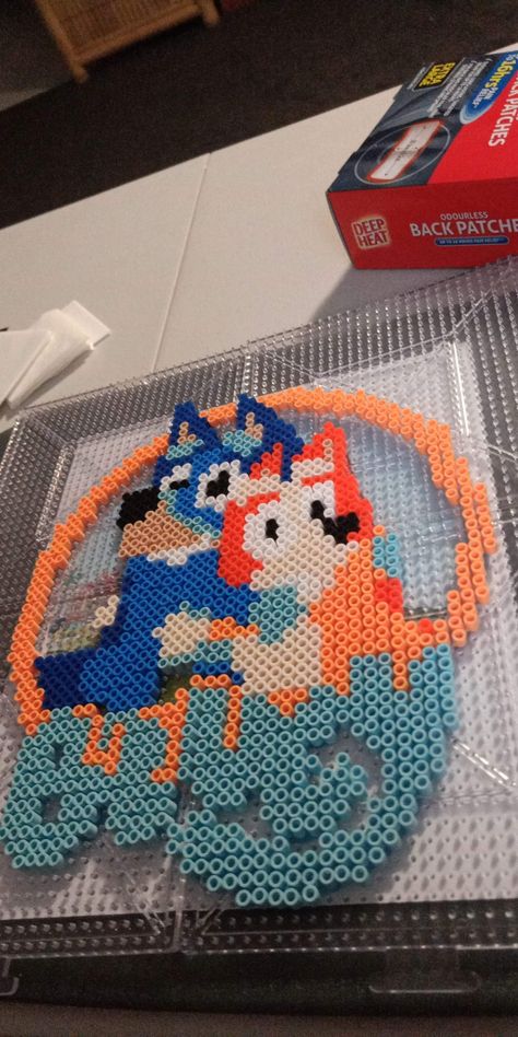 Bluey and bingo cuddle Hama beads Fuse Beads Ideas Bluey, Bluey Bingo Perler Beads, Blue Perler Beads, Perler Bead Blues Clues, Bluey Perler Bead Patterns, Bluey Perler Beads, Blue Perler Bead Patterns, Disney Bluey Perler Beads, Bluey Pearl Beads