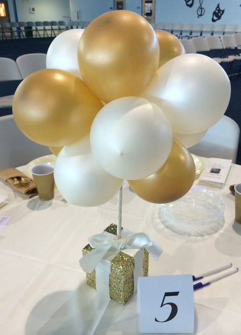 Whether you're planning an event as small as a dinner party, or a celebration as grand as a wedding; LEAVE IT 2 ME will work with you to design that special centerpiece to set the tone of your... Centerpieces For Prom Party, 50th Birthday Balloon Centerpieces, Balloon Decoration For Table, Balloon Decoration Centerpiece, White And Gold Balloon Centerpieces, Low Balloon Centerpieces, 85th Birthday Party Ideas Table Decorations, 80 Birthday Centerpiece Ideas, Table Centerpieces For Work Event