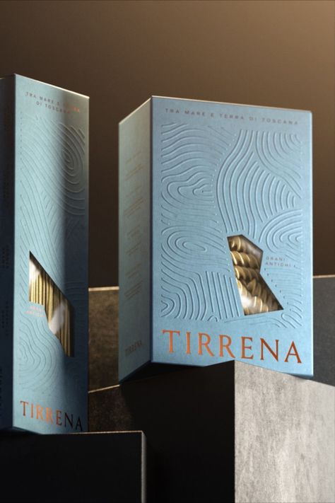 Frescobaldi is one of the most influential family farms on the Italian scene. Recently, the brand turned to Auge Design to create an entirely new visual identity and packaging system. The new system takes inspiration from the farm's land and the nearby ocean, so the box highlights a mimicking of the sea breeze over the farm; plus, the Tyrrhenian Sea inspires the blue box. Beyond the sleek package, the copper foil adds a touch of premium-ness that elevates the packaging further. Luxury Box Design, Sparkling Tea, Modern Packaging Design, Luxury Packaging Design, Modern Packaging, Perfume Bottle Design, Perfume Packaging, Unique Packaging, Box Packaging Design