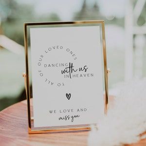 Remember your loved ones in a special way with our "Dancing With Us in Heaven" sign. This loving memory table sign is perfect for weddings, allowing you to honor those who are no longer with us but forever dancing in heaven. Our editable sign features a heartfelt message that will bring comfort and warmth to your celebration FLD069 Dancing In Heaven, Memory Table Sign, Heaven Wedding, Memory Table Wedding, Wedding Memorial Sign, Memory Table, Memorial Signs, Table Sign, Wedding Memorial