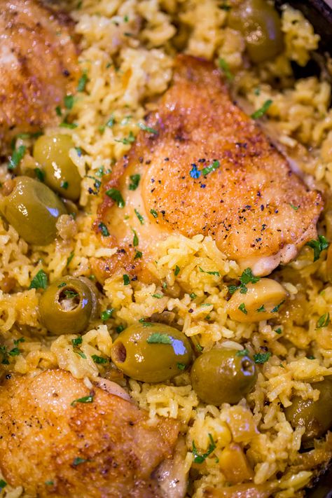 Spanish Olives Chicken and Rice made in a single cast iron skillet is a gorgeous meal made easy with delicious Spanish queen green olives, caramelized onions, garlic and saffron rice. Recipes With Green Olives Dinners, Olive Rice Recipes, Recipes With Green Olives, Chicken And Rice Recipes Spanish, Chicken And Rice Spanish, Chicken And Rice With Green Olives, Spanish Rice With Green Olives, Rice With Olives Spanish, Spanish Chicken Rice And Beans