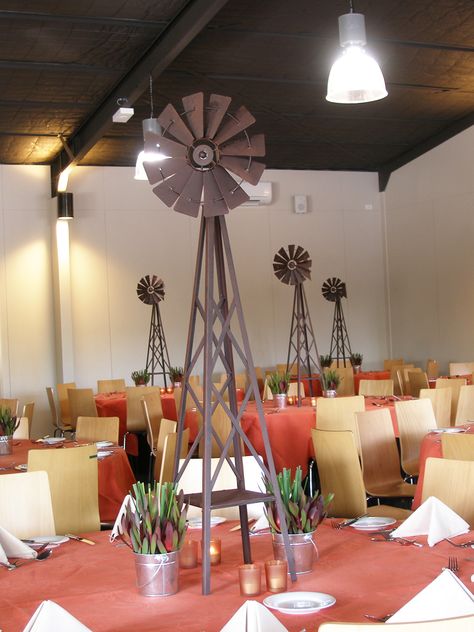 Australiana windmill centerpiece Windmill Centerpiece, Windmill Party Theme, Windmill Wedding, Gala Centerpieces, Farm Table Decor, Farm Windmill, Windmill Decor, Cowboy Birthday Party, Prom Theme