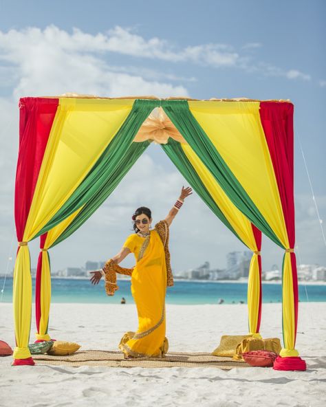 Dolly posing in her reggae inspired decor for her haldi ceremony on the beach in Cancun Mexico. Destination Wedding. JSK Photography Jamaica Facts, Rasta Wedding, Jamaica Party, Jamaican Beaches, Jamaican Party, Jamaican Clothing, Caribbean Carnival Costumes, Haldi Decoration Ideas, Jamaican Colors