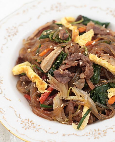 A sweet-salty stir fried noodle dish, Korean japchae is packed with meat, vegetables, flavors, colors and textures. A lovely birthday noodle dish to serve. Korean Japchae, Korean Noodle Dishes, Stir Fried Vegetables, Korean Stir Fry, Fried Noodle, Braised Chicken Breast, Veggies Recipes, Noodle Dish, Stir Fry Noodles