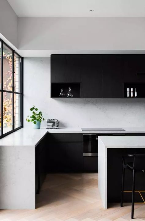 a minimalist black and white kitchen with matte black cabinets, white stone countertops and a backsplash, black stools is a chic space to be Steel Window Design, Kirchen Design, Black Interiors, White Kitchen Design, Victorian Terrace, White Countertops, Kitchen Inspiration Design, Timber Flooring, Black Kitchens