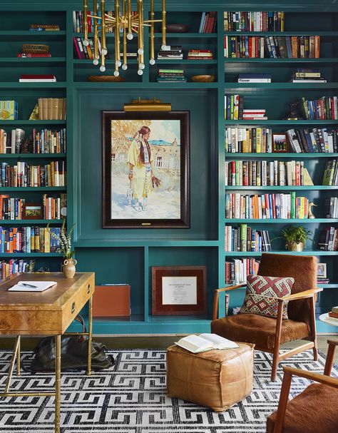 Turquoise bookcase with large artwork and gold chandelier in home workspace small wood desk and leather armchairs. Home Library Rooms, Home Library Design, Built In Bookcase, Murphy Bed, Home Library, Front Room, Home Office Design, 인테리어 디자인, Guest Bedroom