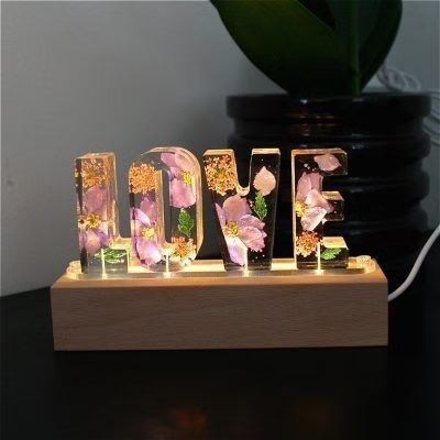 All type of resin items are available Dm us for order (Resin art, small business, mirror, handmade, hand crafted, entrepreneur) #resinarte #smallbusiness #minibracelets #handmadehues #handcrafted #smallbusinessexpo #explorepageready #resinartistofinstagram Glitter Home Decor, Dried Flowers Resin, Letter Resin, Home Decor Lamp, Seni Resin, Flowers Home Decor, Resin Crafts Tutorial, Decor Lamp, Diy Resin Projects