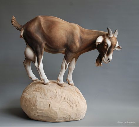 Doe goat on a rock carved in wood by Giuseppe Rumerio. Metal Goat Yard Art, Goat Made Of Clay, Goat Pottery, Goat Statue, Goat Sculpture, Uncultured Swine, Sculpture Installation, A Rock, Nanny