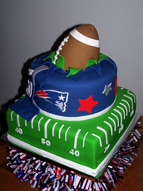 New England Patriots I created this for a friends 50th birthday party. The football is made with gumpaste. Thanks to all the CCer's... Patriots Birthday Party, New England Patriots Cake, Patriots Cake, Nfl Cake, Superbowl Cake, Football Cakes, Patriots Superbowl, Football Birthday Cake, Sports Cakes