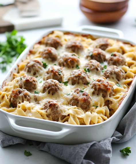 This Swedish meatball casserole is a creamy, comforting dish with tender meatballs, egg noodles, and a rich gravy. Swedish Meatball Noodle Casserole, Creamy Swedish Meatball Noodle Bake, Meatball Noodle Casserole, Swedish Meatball Noodle Bake, Swedish Meatball Casserole Recipe, Swiss Meatballs, Meatballs Egg Noodles, Meatballs And Noodles Recipe, Swedish Meatball Casserole