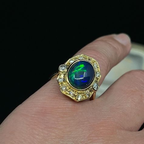 We love this solid Opal ring, if anything it has a bit of an air of 1980’s spunk 😁 The oval solid Opal originates from Ethiopia and its bezel set within an Etruscan reminiscent boarder in 18K yellow gold, set with 12 round brilliant cut Diamonds which are graded in the setting, G to light Champagne. We know how we feel about Champagne Diamonds 🫠🥂 This Opal is dominantly azure blue with flashes of apple green and carnelian. 👌🏽we love it. This ring is now reduced half price making it totally... Solid Opal Ring, Azure Blue, Half Price, Champagne Diamond, Apple Green, Opal Ring, Gold Set, Round Brilliant Cut Diamond, Opal Rings