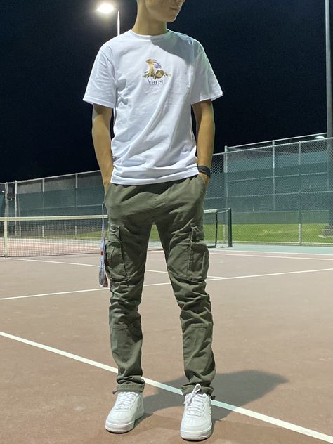 Mens Olive Cargo Pants Outfit, Cargo Pants Air Force Ones, Green Cargo Pants White Shirt Outfit Men, Olive Cargos Outfit Men, Cargo Pants Vans Outfit Men, Cuffed Cargo Pants Outfit Men, White Shirt And Olive Green Pants Men, Summer Outfits Men Cargo Pants, Mens Cargo Pants Outfit Casual