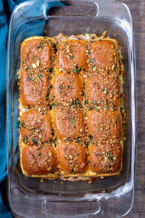 Cheesy Garlic Masala Pav Sliders is a garlic, cheese and pav bhaji lovers delight and a great party appetizer. Its made with pav (dinner rolls) slathered in garlic butter and stuffed with spicy bhaji and cheese. It's baked till cheese is all melted and served warm and soft topped with some onions and cilantro. #masalapav #pavbhaji #indianfood #indianstreetfood #streetfood #partyfood #potluckrecipe #sliders Pav Sliders, Masala Pav, Veg Appetizers, Pav Recipe, Mumbai Street Food, Veg Snacks, Indian Appetizers, Pav Bhaji, Garlic Cheese