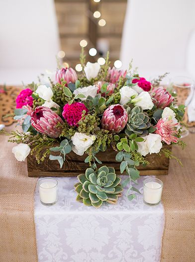 Photo via Project Wedding Box Wedding Centerpieces, Bohemian Centerpieces, Succulent Wedding Centerpieces, Protea Wedding, Pink Centerpieces, Green Centerpieces, Tafel Decor, Protea Flower, Rustic Wedding Centerpieces