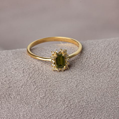 With its shimmering pale green color, peridot stone is also known as the "evening emerald". It is a gemstone often associated with spirituality and expression. Our rectangular peridot stone ring surrounded by real diamonds will add elegance to your hands. It is a ring that you can use both on special occasions and in daily life. It is a beautiful and stylish product that you can gift to yourself and your loved ones. The color of those born in August is Peridot. Our necklace compatible with our r Dainty Wedding Ring Emerald, Vintage Green Rings, Engagement Rings Gold Colored Stone, Peridot And Diamond Engagement Rings, Virgo Engagement Ring, Diamond And Peridot Engagement Rings, Green Birthstone Ring With Gemstone Accents For Formal Occasions, Green Emerald Ring With Gemstone Accents For Anniversary, Rectangular Emerald Ring With Halo Setting