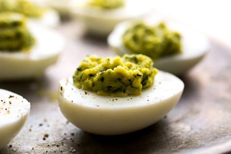 Pesto-Filled Deviled Eggs Recipe Pesto Deviled Eggs, Vegetarian Pesto, Healthy Picnic Foods, New York Times Recipes, Eggs Deviled, Healthy Picnic, Bbq Side Dishes, Hard Cooked Eggs, Bbq Sides