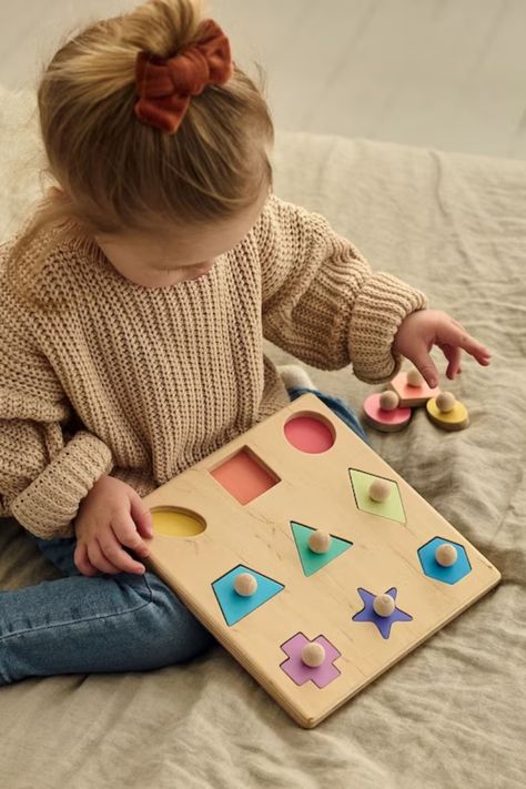 Playing with this Montessori wooden shape puzzle the child will easily learn colors and geometric shapes. The toy will also help in the development of fine motor fingers, coordination of hand movements. Wooden Shape Puzzle, Shape Puzzle, Hand Movements, Wooden Educational Toys, Baby Puzzles, Handmade Baby Toys, Educational Toys For Toddlers, Learn Colors, Wooden Baby Toys