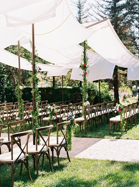 This gorgeous garden wedding in Southern California is guaranteed to steal your heart. We especially love the ombre flower wall with fuchsia roses and dusty blue hydrangeas. Oh and the groom's gift to his bride is making us all misty-eyed. So basically we love it all! Outdoor Wedding Ceremony Draping, Home Wedding Ceremony Outdoor, Wedding Ceremony Shade Ideas, Shaded Wedding Ceremony, Garden Wedding Canopy, Outdoor Wedding Shade Ideas, Canopy Wedding Ceremony, Covered Wedding Ceremony, Shade For Wedding