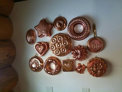 Copper mold display on my kitchen wall Copper Molds Display, Copper Molds Display Kitchens, Copper Aesthetic, Copper Kitchen Accents, Thrift Inspiration, Antique Kitchen Utensils, Copper Molds, Vintage Copper Pots, Copper Collection