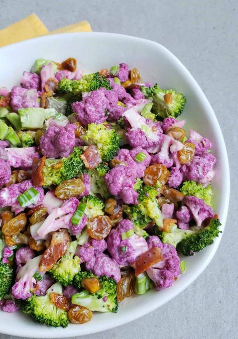 Purple Cauliflower & Broccoli Raisin Salad. A healthy way to add a little color to your dinner table. Purple Cauliflower Salad, Broccoli Raisin Salad, Purple Cauliflower Recipe, Southern Thanksgiving Recipes, Broccoli Salad With Raisins, Raisin Salad, Purple Cauliflower, Southern Thanksgiving, Cauliflower Salad