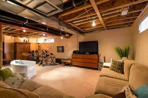 31 Unfinished Basement Ideas & Designs To Spruce Up Your Room (2021) Lighting Unfinished Basement Ceiling, Decorating Ideas For Unfinished Basement, Unfinished Basement Lighting, Finished Basement Bars, Basement Unfinished, Unfinished Basement Decorating, Unfinished Basements, Unfinished Basement Walls, Unfinished Basement Bedroom