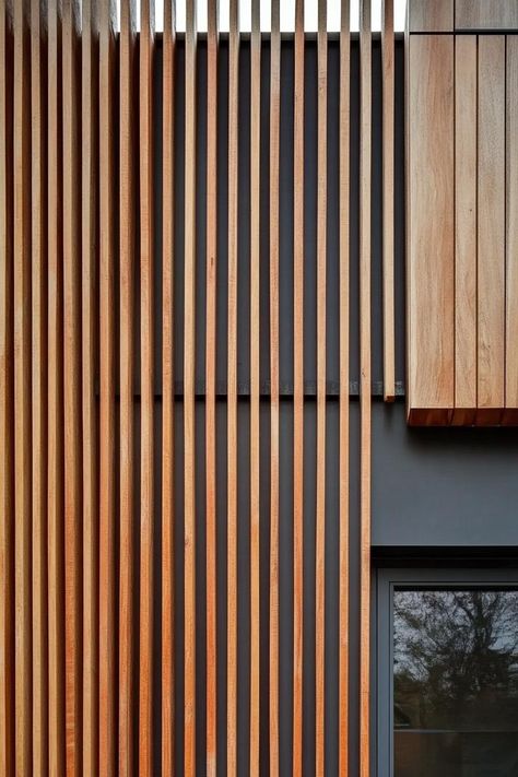 Modern house facade with timber gladding and vertical wood slat panels. The chic, rustic charm of timber-clad houses might just be the trendiest look nobody warned you about. Timber Batten Facade, Wood Facade Architecture Design, Vertical Louvers Facade, Wood Facade Texture, Vertical Timber Cladding, Nordic Houses, Building Cladding, Wood Fencing, Cabin Modern