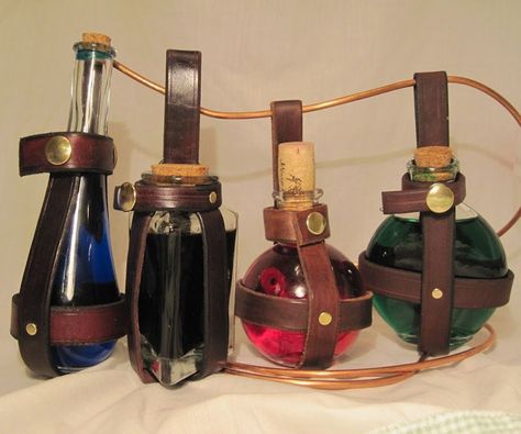 Every brave adventurer needs to carry around liquids and components with him. What better way than in a glass potion bottle with a handmade leather holder?I've made several dozen of these, and if you're interested I've documented the step by step process. Potion Bottle Holder, Steam Punk Diy, ขวดโหล Mason Jar, Armadura Cosplay, Steampunk Crafts, Steampunk Cosplay, Steampunk Diy, Cosplay Tutorial, Steampunk Accessories