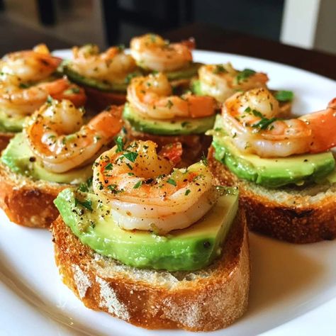 🦐 Garlic Shrimp Crostini with Avocado 🥑 Ingredients: For the Crostini: 🥖 1 baguette, sliced into 1/2-inch pieces 🧈 2 tbsp olive oil 🧄 1 clove garlic, halved (for rubbing) For the Garlic Shrimp: 🍤 1/2 lb large shrimp, peeled and deveined 🧄 2 cloves garlic, minced 🧈 1 tbsp butter 🧂 Salt & pepper to taste 🌿 1 tbsp fresh parsley, chopped For the Avocado Spread: 🥑 1 large avocado, mashed 🍋 1 tsp lemon juice 🧂 Salt & pepper to taste Instructions: Prepare the Crostini: Preheat oven to 400°F (200°... Shrimp And Avocado Crostini, Mini Avocado Toast Appetizer, Shrimp Crustini Appetizers, Shrimp Charcuterie Board, Olive Appetizer Ideas, Shrimp Crostini, Cocktail Snacks, Garlic Parmesan Shrimp, Olive Appetizer