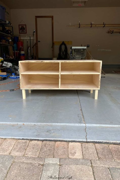 My daughter recently moved into her very first college apartment and she needed some new furniture built. One of those pieces was a TV stand. Today I am going to share with you how I built this DIY TV stand. Diy Tv Stand With Shelves, Diy 75 Inch Tv Stand, Tv Stand Homemade, Building Tv Stand, How To Make A Tv Stand Diy, Easy Tv Stand Diy, Diy Entertainment Stand, 2x4 Tv Stand, How To Build A Tv Stand