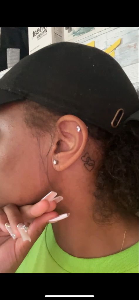 heart tattoo behind the ear Hearts Behind The Ear Tattoo, Heart Behind The Ear Tattoo, Matching Tattoos Behind Ear, Heart Ear Tattoo, Tattoo Behind Ear Heart, Two Hearts Behind Ear Tattoo, Hello Kitty Behind The Ear Tattoo, Heart Tattoo Small Behind Ear, Simple Ear Piercing Ideas